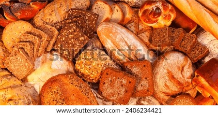 Bread and biscuits. Flour products. Sweet products made of flour and dough. Yeast rolls and bread Royalty-Free Stock Photo #2406234421