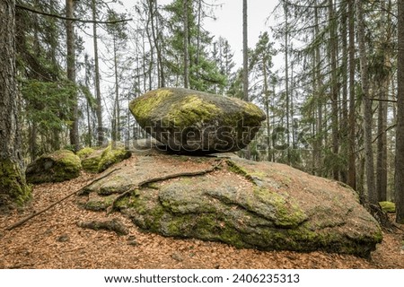 Wackelstein Wobble Stone near Thurmansbang megalith granite rock formation in winter in bavarian forest, Germany Royalty-Free Stock Photo #2406235313