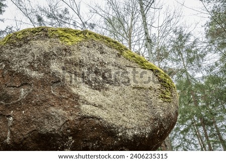 Wackelstein Wobble Stone near Thurmansbang megalith granite rock formation in winter in bavarian forest, Germany Royalty-Free Stock Photo #2406235315