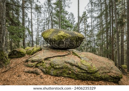 Wackelstein Wobble Stone near Thurmansbang megalith granite rock formation in winter in bavarian forest, Germany Royalty-Free Stock Photo #2406235329