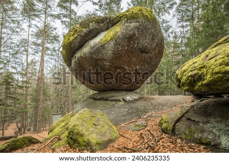 Wackelstein Wobble Stone near Thurmansbang megalith granite rock formation in winter in bavarian forest, Germany Royalty-Free Stock Photo #2406235335