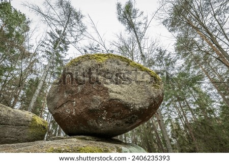 Wackelstein Wobble Stone near Thurmansbang megalith granite rock formation in winter in bavarian forest, Germany Royalty-Free Stock Photo #2406235393