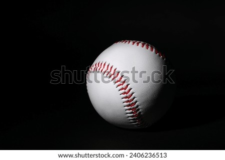One leather baseball ball on black background