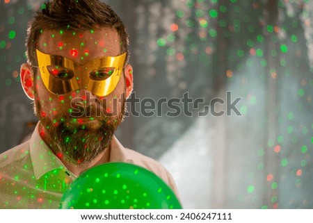 Happy man celebrating birthday on color background. Party concept. New year