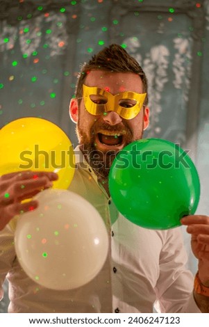 Happy man celebrating birthday on color background. Party concept. New year