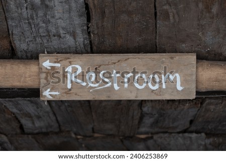 Toilet or restroom wooden sign