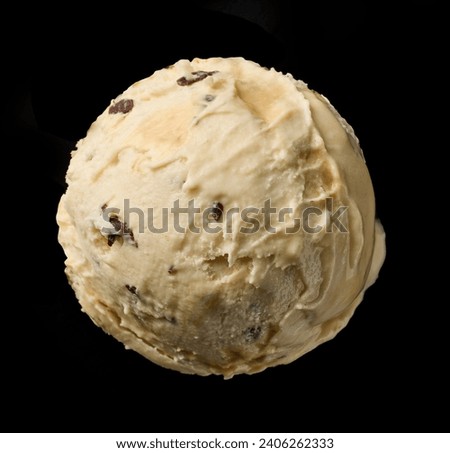 coffee liqueur ice cream scoop with chocolate pieces  isolated on black background, top view