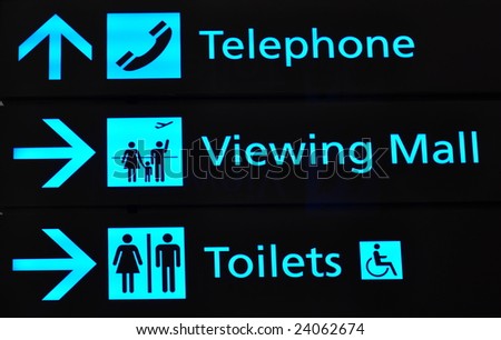 Bright blue directional signs in airport