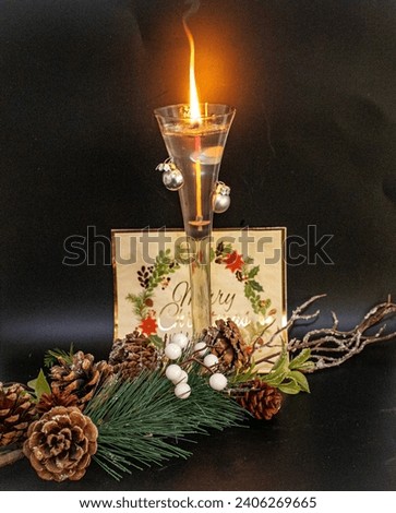 Festive decor. The christmas ornament with a candle and yule log brings a traditional touch to festive decor. Meticulous details and carefully scattered holiday symbols provide warmth and a welcoming 