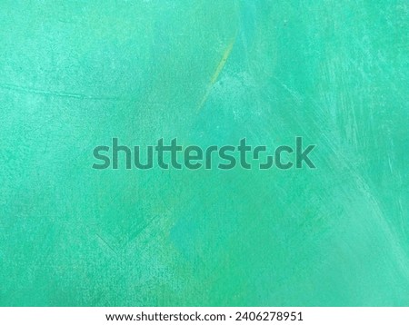 Abstract green watercolor background pattern texture on canvas.
