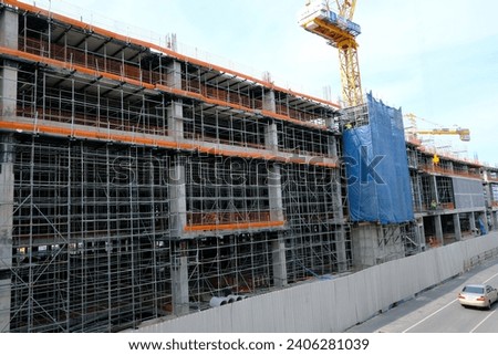 New construction site with crane and mechanical equipments background.