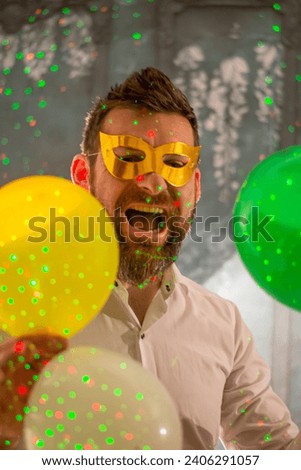 Happy man celebrating birthday on color background. Party concept. New year concept.