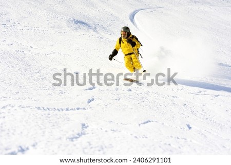 Ski instructor skiing in Courchevel off piste, Valley Des Avals, French Alps, France Royalty-Free Stock Photo #2406291101