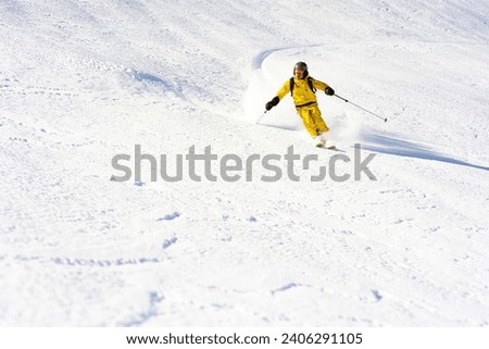 Ski instructor skiing in Courchevel off piste, Valley Des Avals, French Alps, France Royalty-Free Stock Photo #2406291105