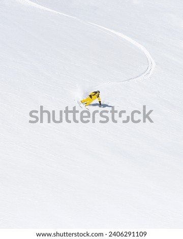 Ski instructor skiing in Courchevel off piste, Valley Des Avals, French Alps, France Royalty-Free Stock Photo #2406291109