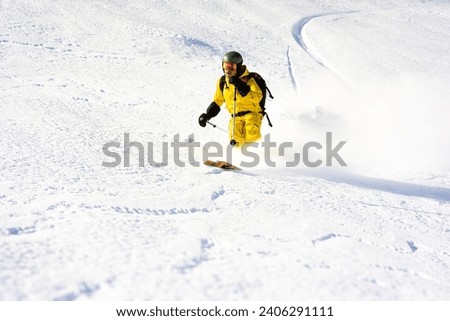 Ski instructor skiing in Courchevel off piste, Valley Des Avals, French Alps, France Royalty-Free Stock Photo #2406291111