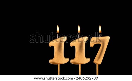 Golden candle 117 with flame - Birthday card on dark luxury background