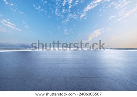 Empty brick floor and sunset clouds background Royalty-Free Stock Photo #2406305507