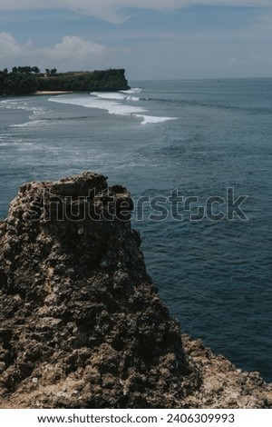 Rocky shore on the background of the ocean and waves