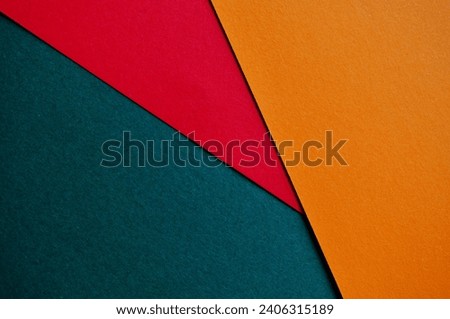 minimalistic orange - red and green colored background - empty papers 