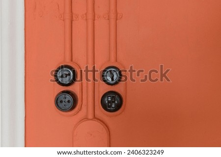 Mid-twentieth century electricity sockets and switches Royalty-Free Stock Photo #2406323249