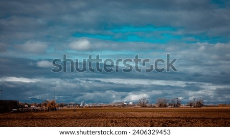 Autumn view of the countryside in Poland concept photo. Beautiful views in Polish farmland. High quality wallpaper. Ambient cloudy sky. Photo concept for travel blog, magazine, article