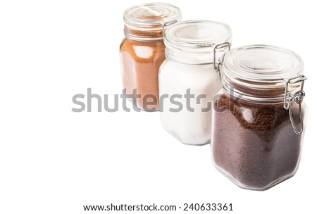 Instant coffee, chocolate drink powder and sugar in glass jar container
