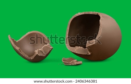 Broken chocolate egg on green screen 