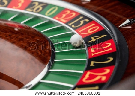 Close up roulette wheel white ball Royalty-Free Stock Photo #2406360001