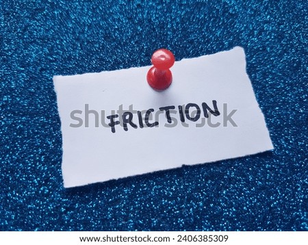 Friction written on a blue background. Royalty-Free Stock Photo #2406385309