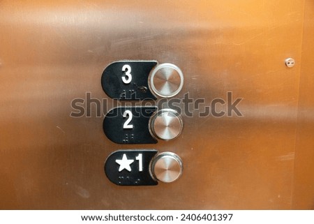 Elevator buttons inside the elevator, for floors 1, 2 and 3
