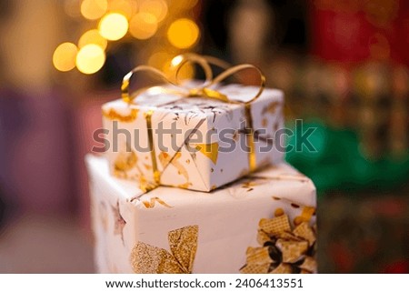 
Gifts in beautiful packages with a bow for the New Year tree