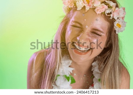 Carnaval Brazil. Excited and Cheerful. Face of brazilian blonde woman wearing carnival costume. Bright background. Party concept, celebration and festival.