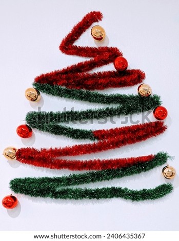 Multi-colored tinsel in the form of a Christmas tree 