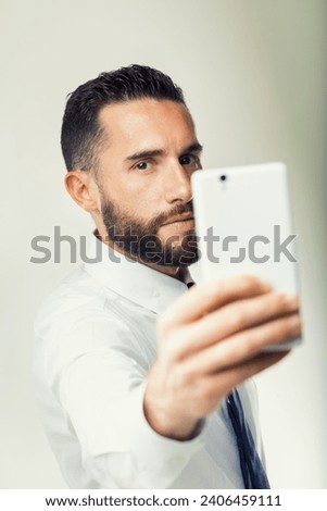 Man in formal attire demonstrates the importance of internet connectivity in modern business