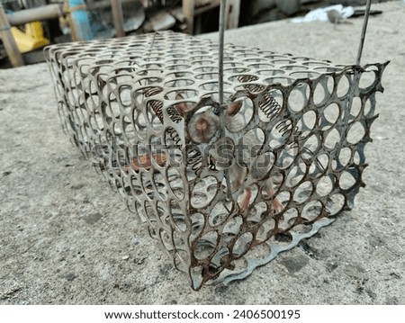 side view - Small mouse trapped in a metal box trap Royalty-Free Stock Photo #2406500195