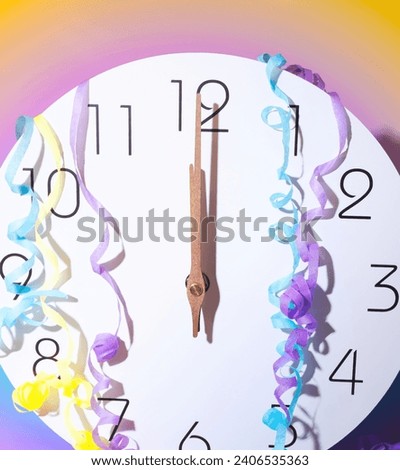 New Years Clock Countdown at 12 Midnight, Clock Strikes Midnight, Party Streamers, New Years Party Celebration Countdown on a Pastel Background