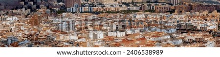 High-resolution panorama showcasing the cityscape of Alicante, Spain. The rooftops of houses and windows are meticulously captured, highlighting the smallest details for a comprehensive view