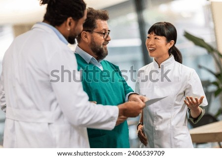 Group of multiracial doctors standing and discussing about results