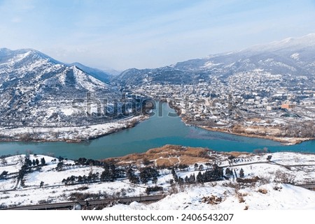 Jvari Monastery is one of the most famous place in Georgia. Top view of with Mtskheta town and the confluence of the Mtkvari and Aragvi rivers. Royalty-Free Stock Photo #2406543207