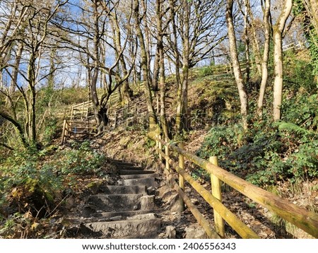 Footpath leading to Sgwd Yr Eira - Waterfall of the Snow, is one of four waterfalls you'll encounter along the Four Falls Trail in Brecon Beacons National Park near Pontneddfechan in South Wales. Royalty-Free Stock Photo #2406556343