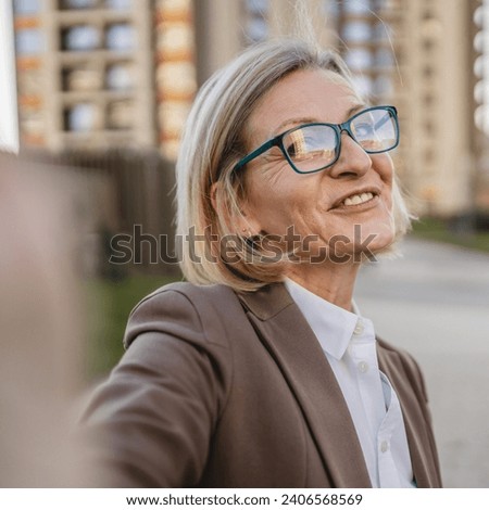 One mature woman self potrait selfie UGC User generated content Royalty-Free Stock Photo #2406568569