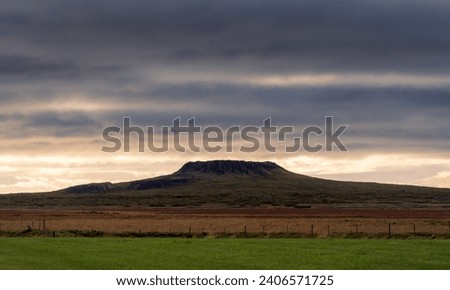 Eldborg crater at sunset with dramatic sky, Iceland