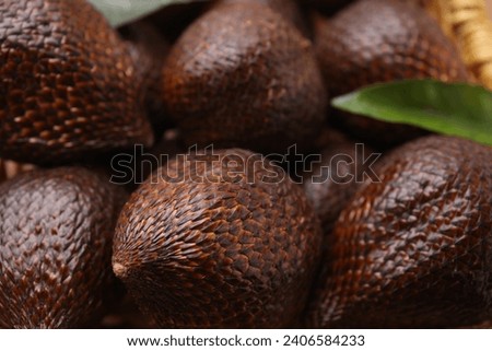 Delicious salak fruits and green leaf, closeup
