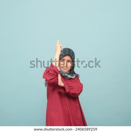 Asian girls wearing hijab and in red shirt show random poses