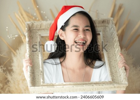 Portrait of Teenage girl with braces in picture frame