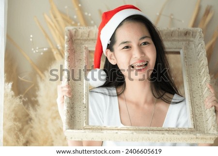 Portrait of Teenage girl with braces in picture frame