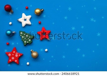 New Year and Christmas figures, stars, Christmas trees, balls, snowflakes on a blue background