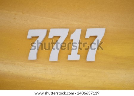 The golden yellow painted wood panel for the background, number 7717, is made from white painted wood.