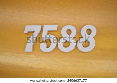 The golden yellow painted wood panel for the background, number 7588, is made from white painted wood.